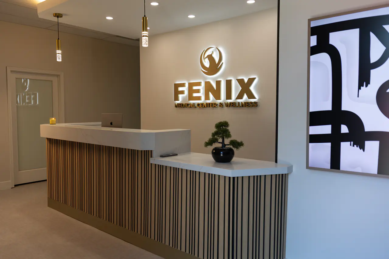 Photograph of the Fenix reception desk from the side; no people